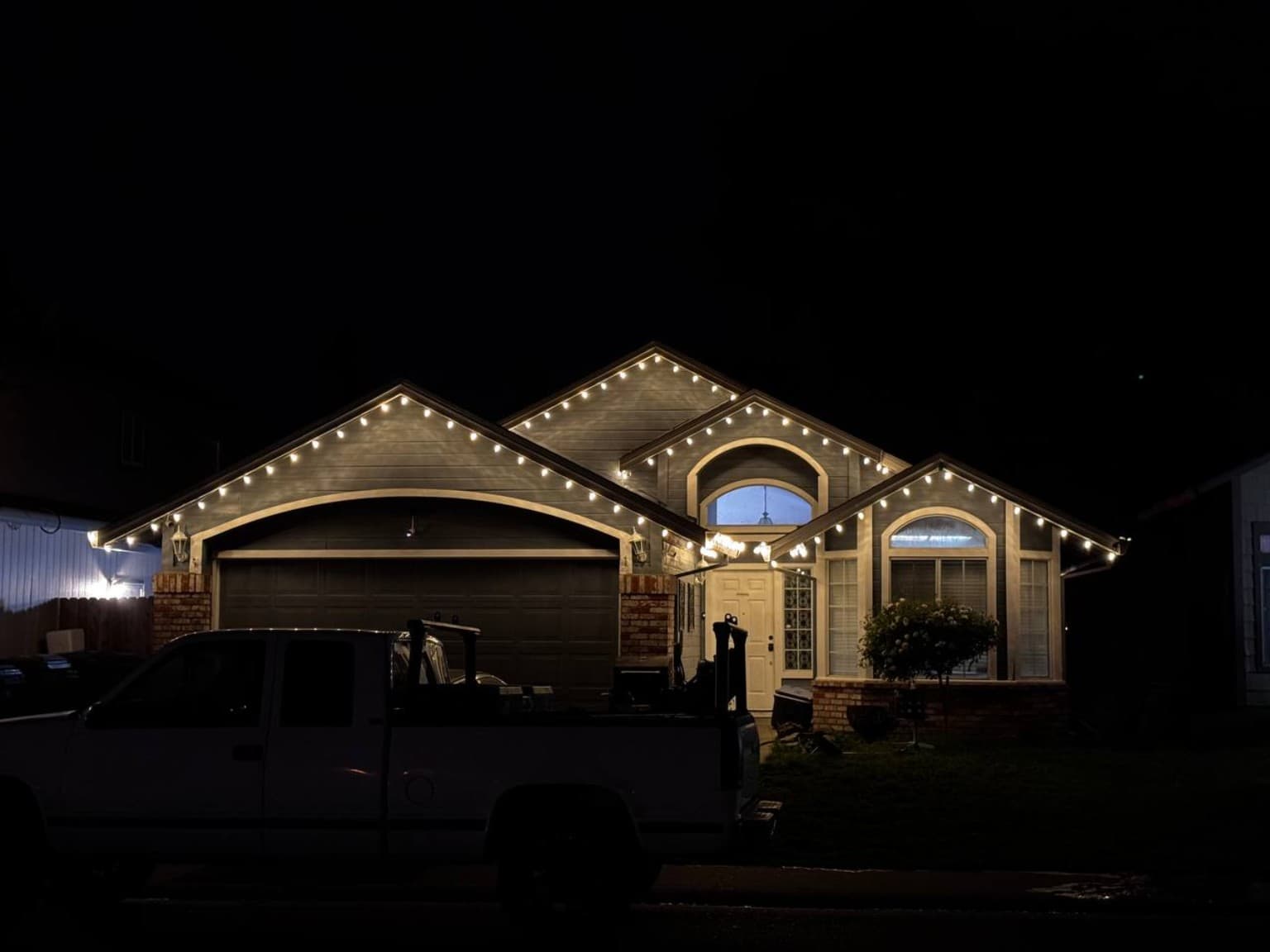 White roofline — garage view installed by SWFL Permanent Lighting