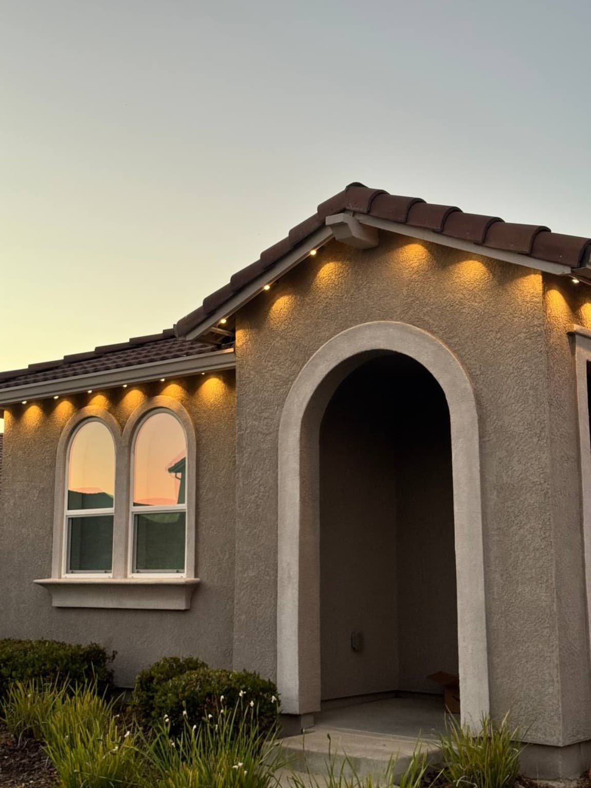 Warm arched entry installed by SWFL Permanent Lighting